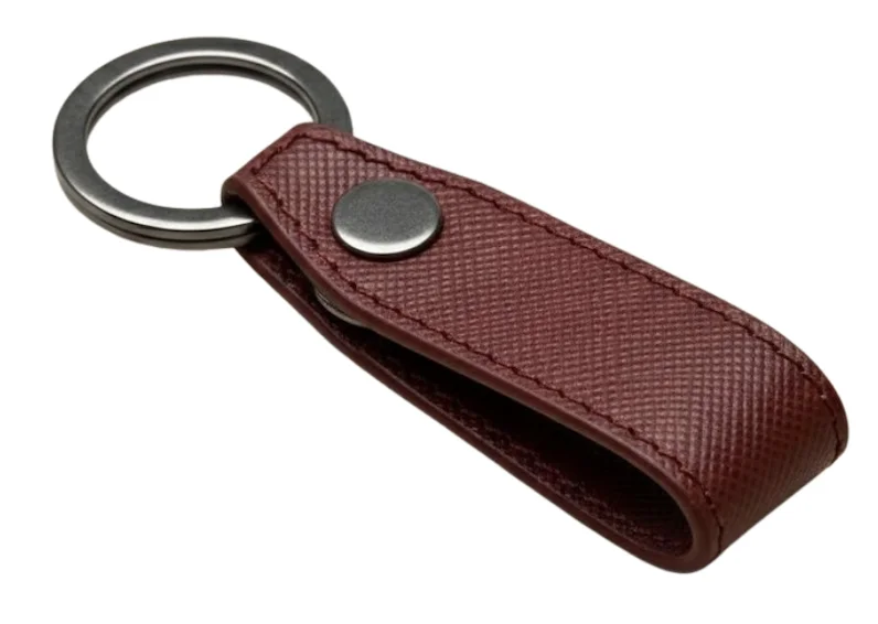 Maroon leather keyring with metal ring and textured finish
